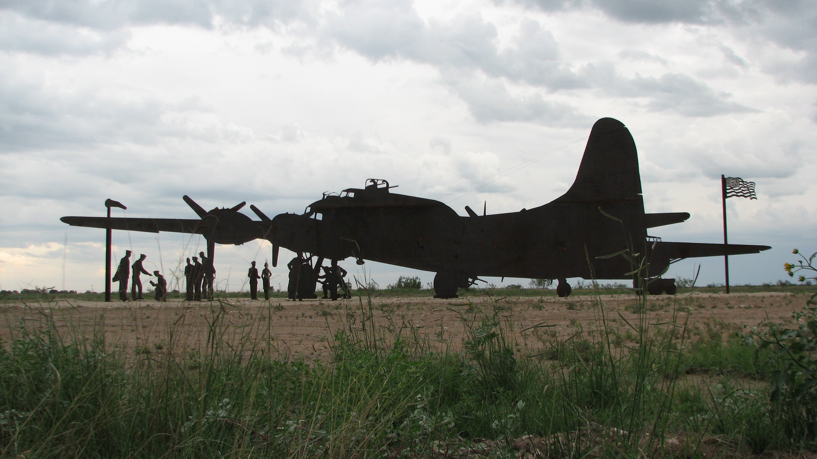 Clouds gather around the sculpture.