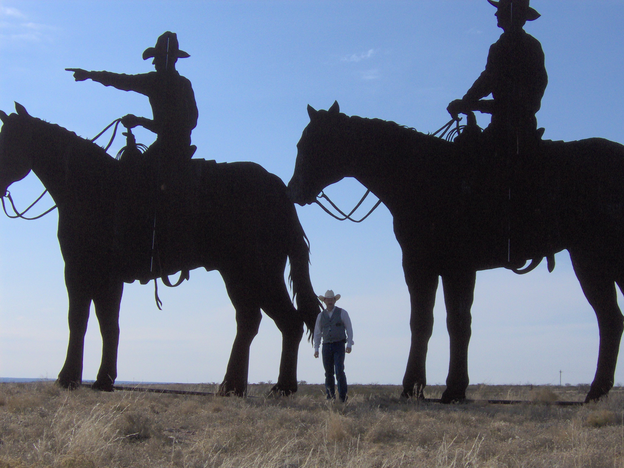 Brian Norwood standing with the lead cowboys.